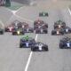 La partenza della Feature Race di F2 2024 a Barcellona. Sullo sfondo, Antonelli parte dalla pit lane